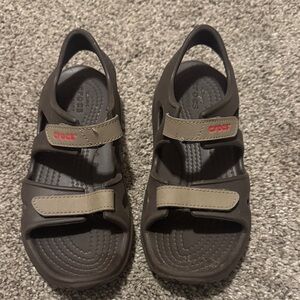 CROCS boys Dark Brown Sandals with Red Accents